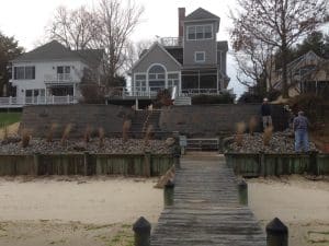 retaining wall with house in the background
