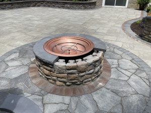 outdoor fireplace on stone patio