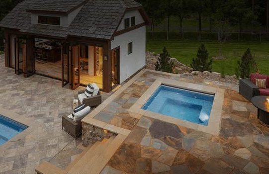 stock picture of backyard with pool, hottub and patio