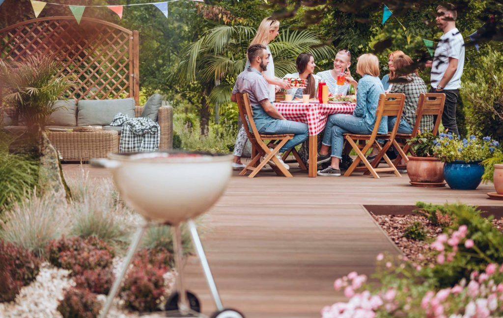 stock photo dinner party on wooden deck/patio